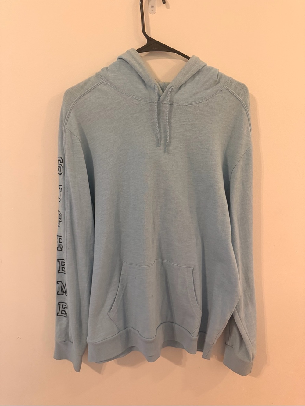 Supreme Light Blue Hoodie with Red Logo Tag